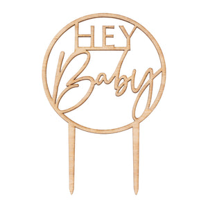 wooden baby shower cake topper with the words "hey baby" in the middle 