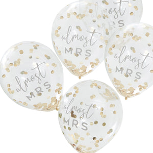 clear balloons with almost mrs written on them and gold foil confetti inside 