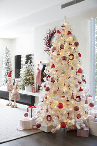 white christmas tree decorated in a candy cane theme