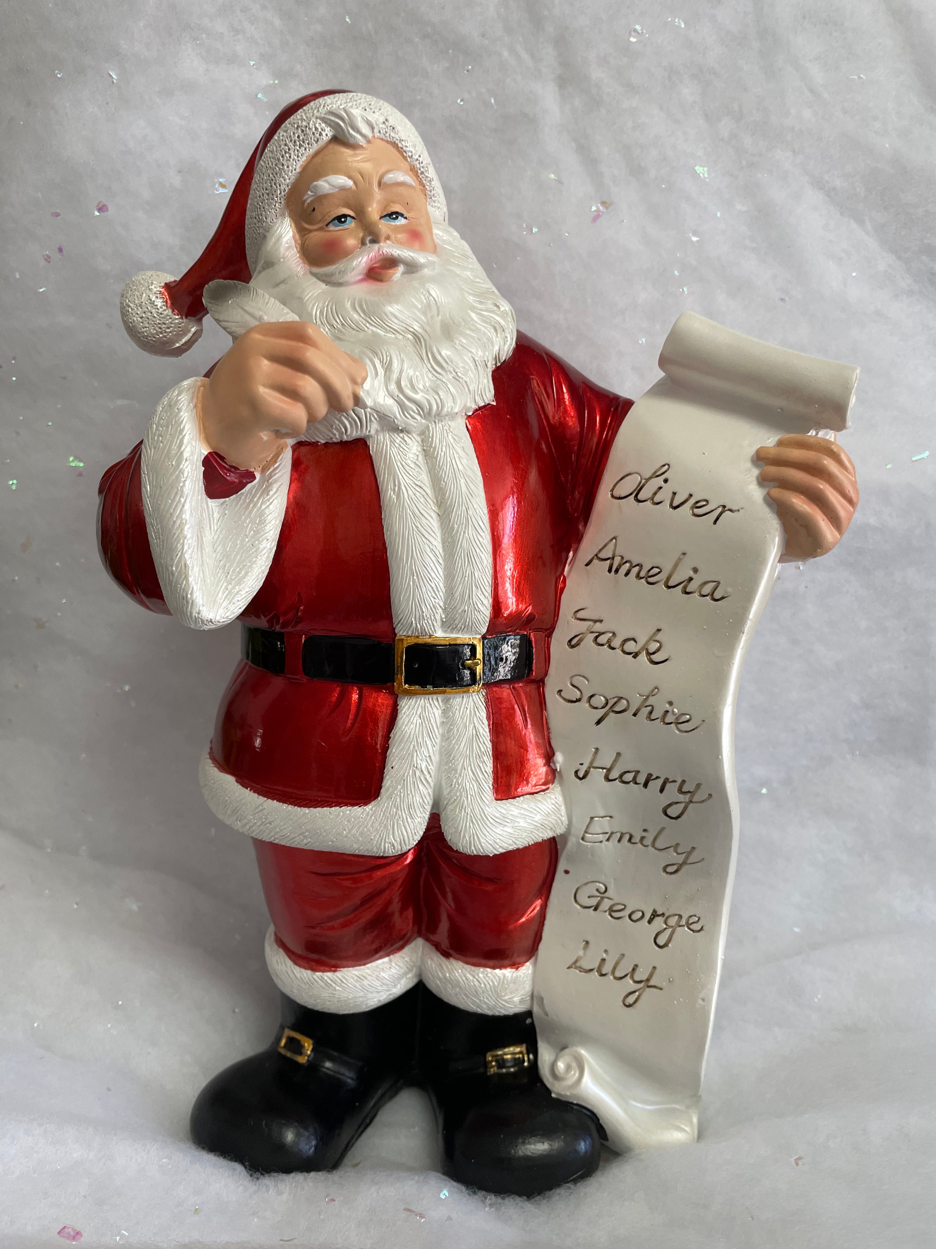 Santa checking his list decoration - made from resin 