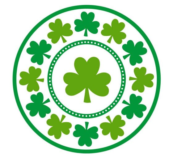 Round paper plates decorated with shamrocks.